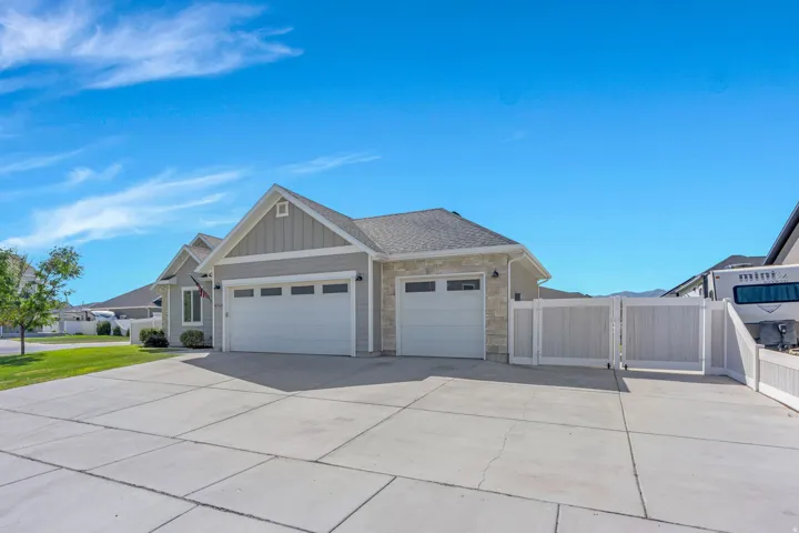 Light gray siding exterior with stone accents