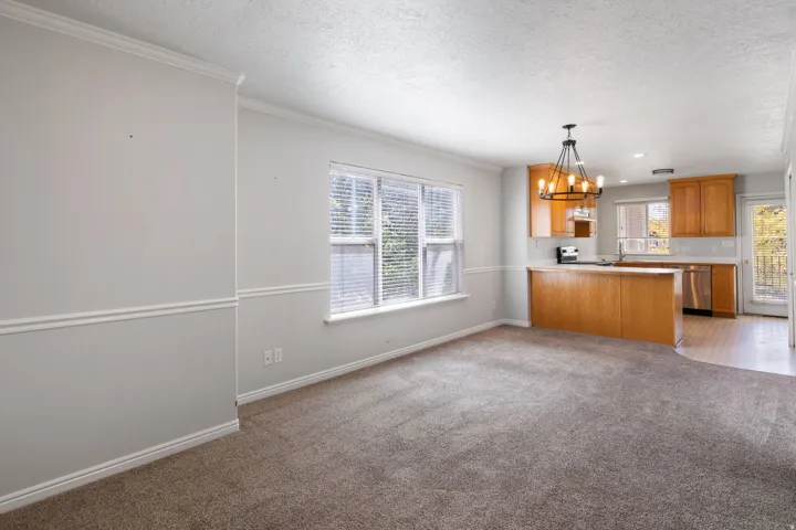 Neutral tone wall paint with decorative trim and textured ceiling