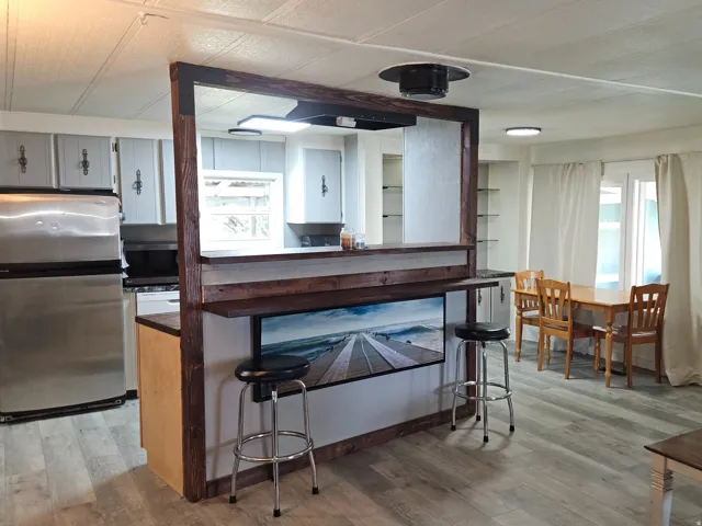 Open-concept living area with wood-finish flooring