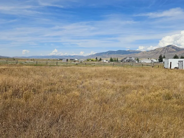 Expansive open field with distant mountain range