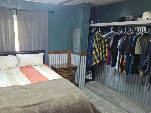 Corrugated metal wainscoting and coordinating wall treatment