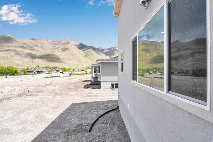 Exterior stucco finish with large windows
