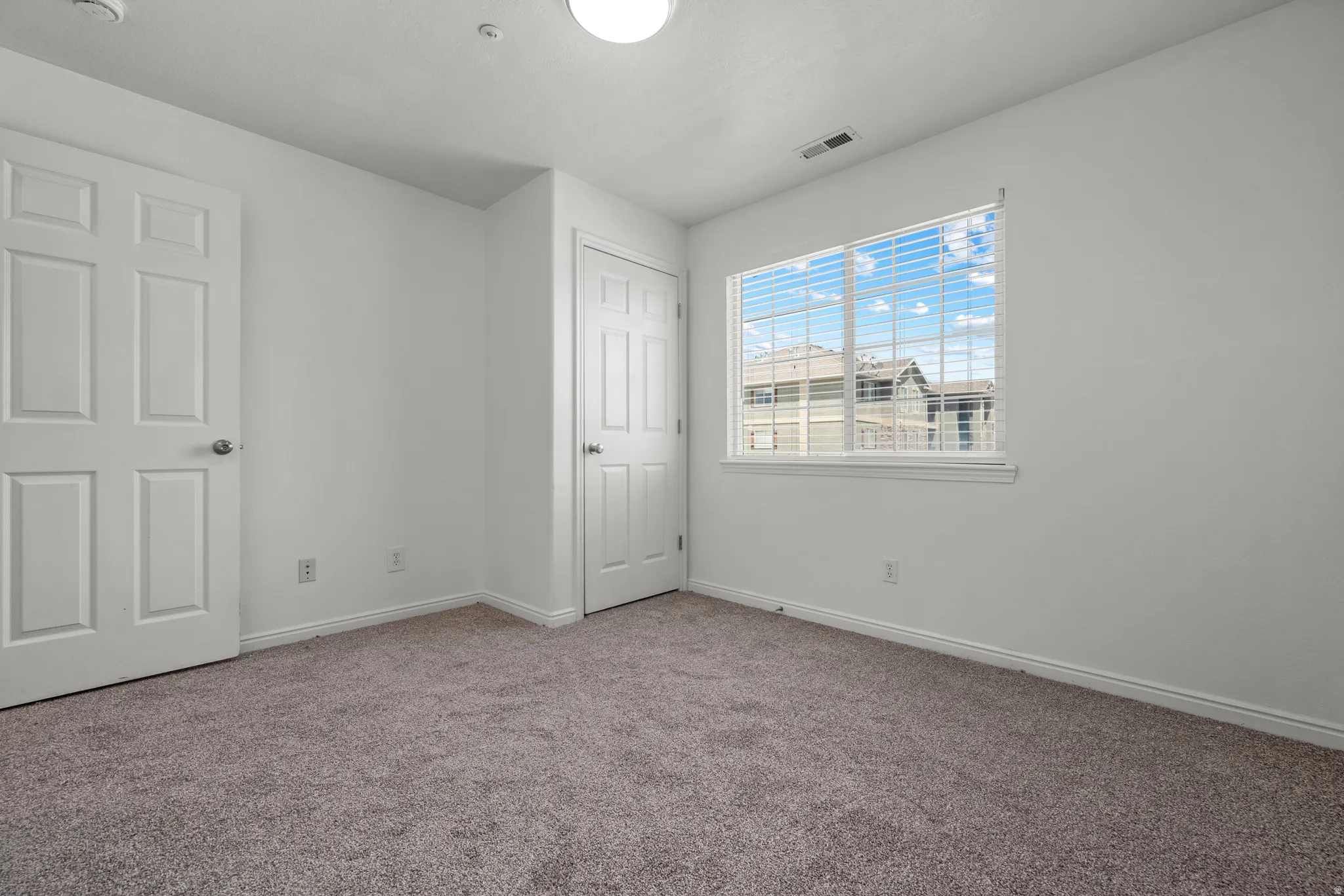 Neutral-toned carpeting throughout