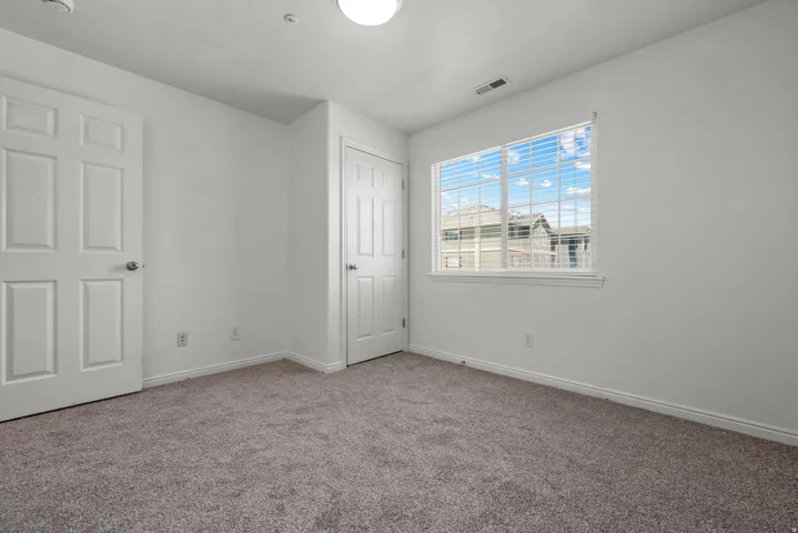 Neutral-toned carpeting throughout