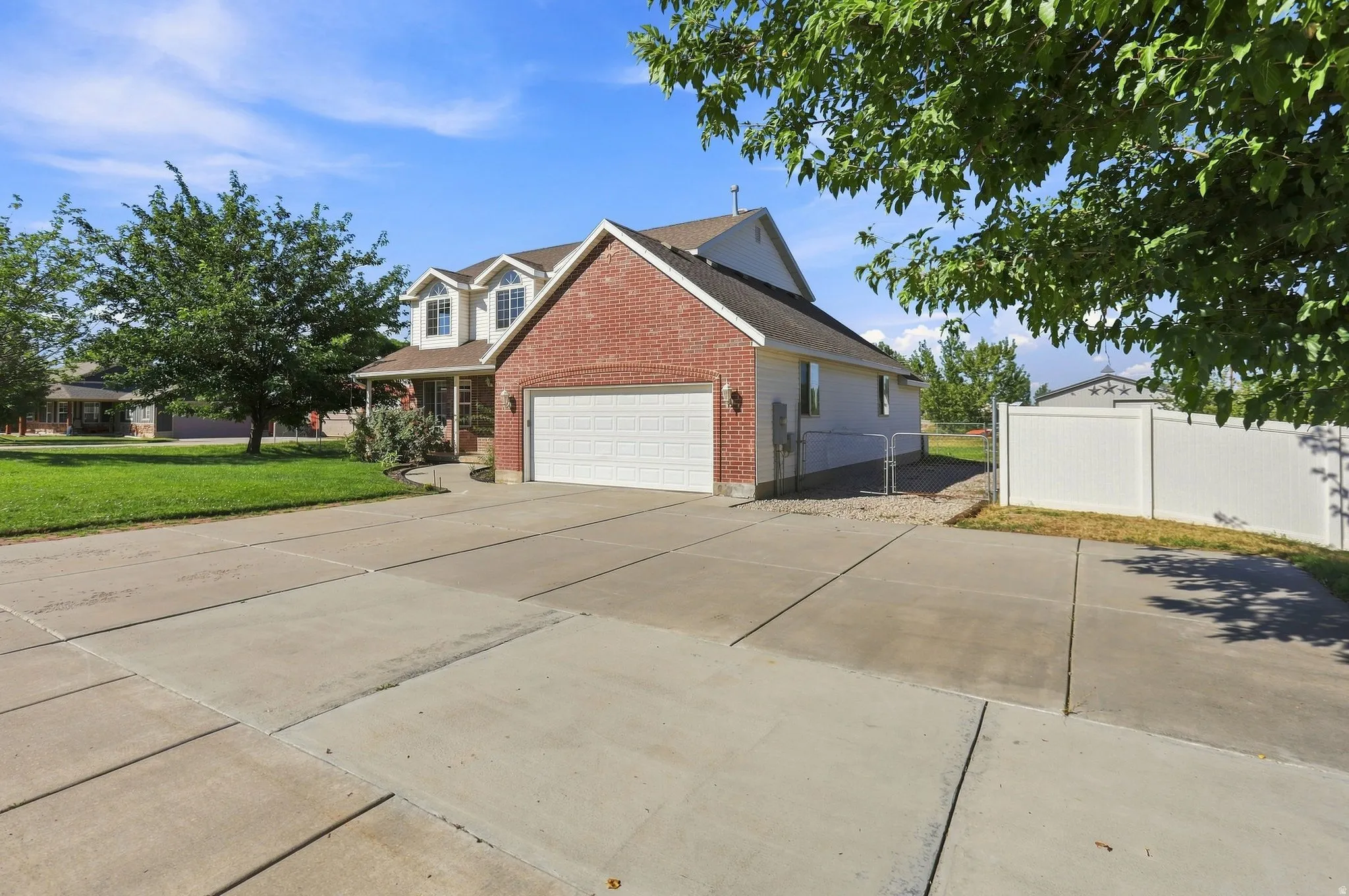 Brick and siding exterior with a two-car garage