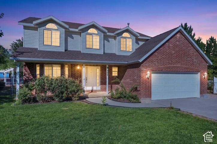 Brick and siding exterior with a two-car garage