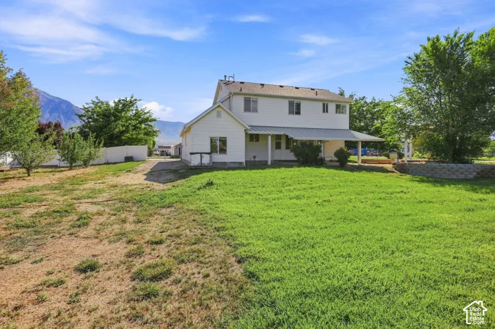 Two-story exterior with white siding and a covered patio