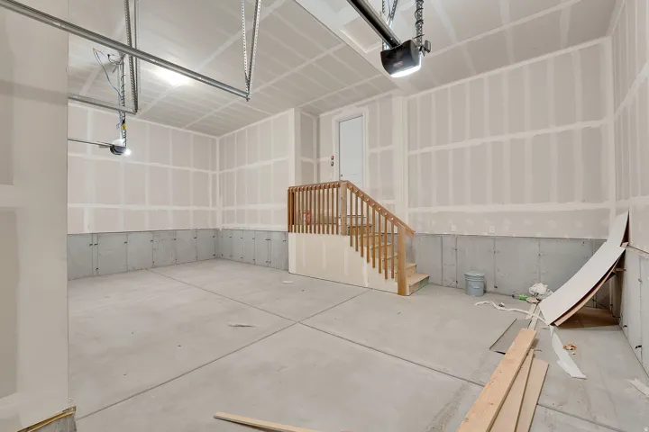 Concrete flooring with wood staircase
