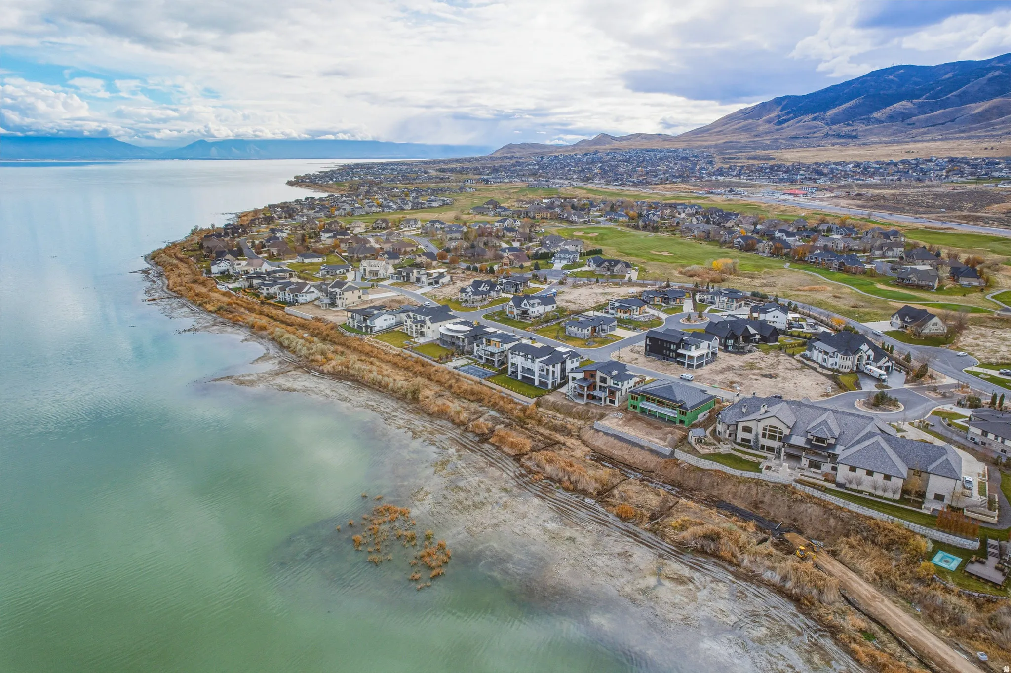Lakeside community with mountain backdrop