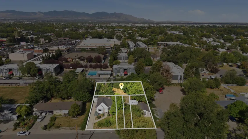 Aerial view of a residential property with a detached house