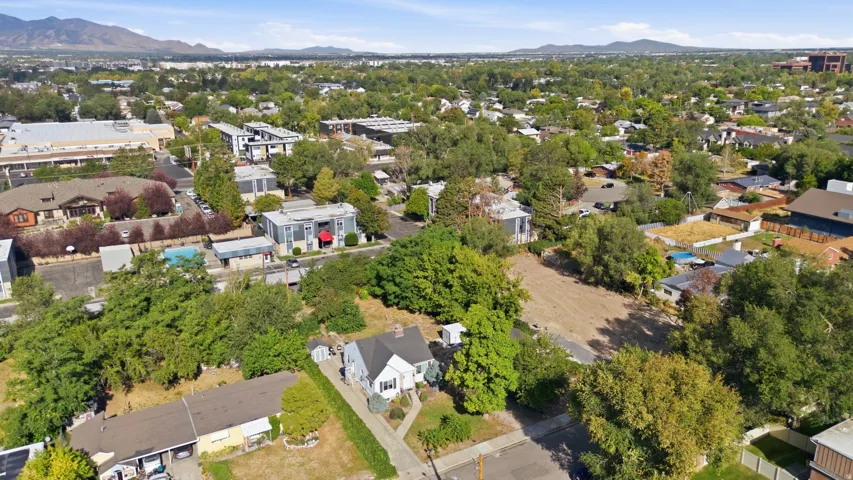 Expansive neighborhood with abundant mature trees and distant mountain ranges