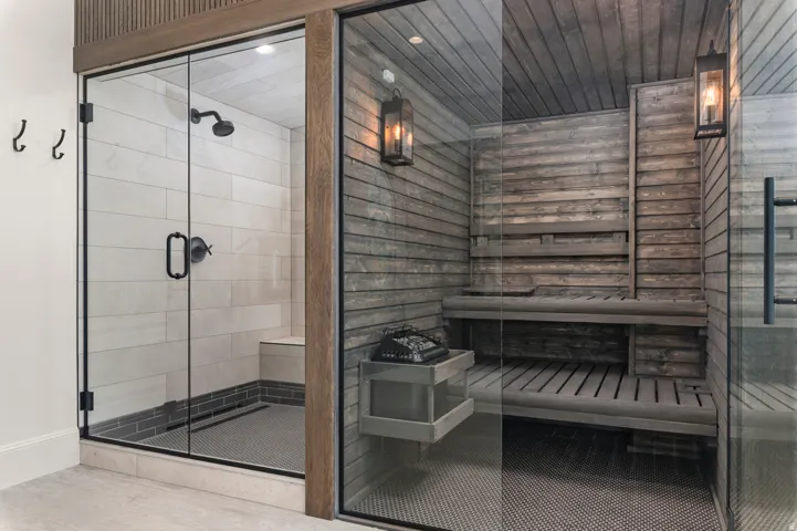 Shower and sauna with glass enclosures