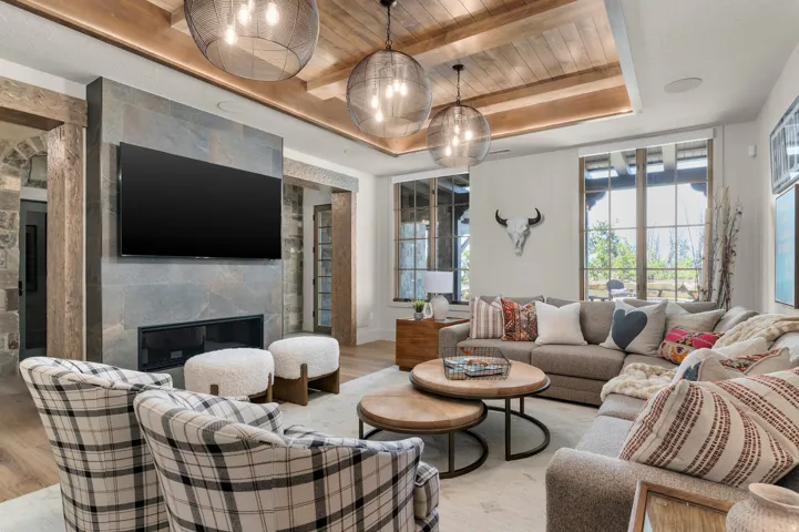 Wood-finish flooring, recessed lighting, and a coffered ceiling with exposed beams