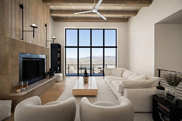 Vaulted wood-beamed ceilings with a modern ceiling fan