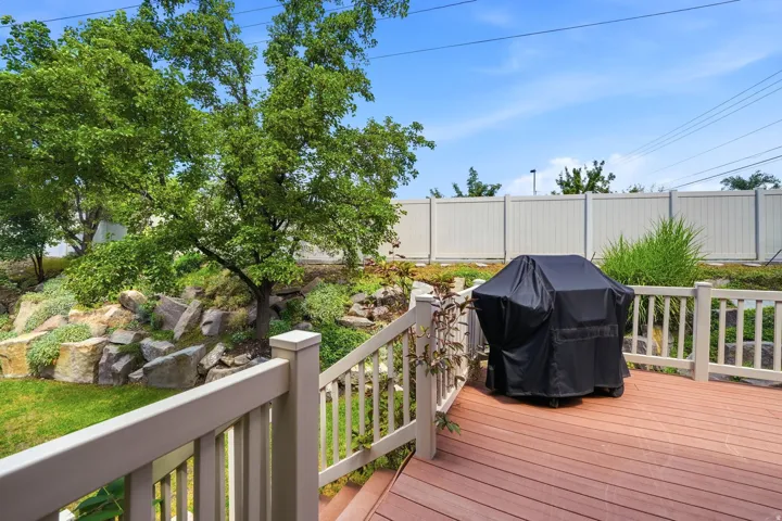 Composite wood deck with a light-toned railing