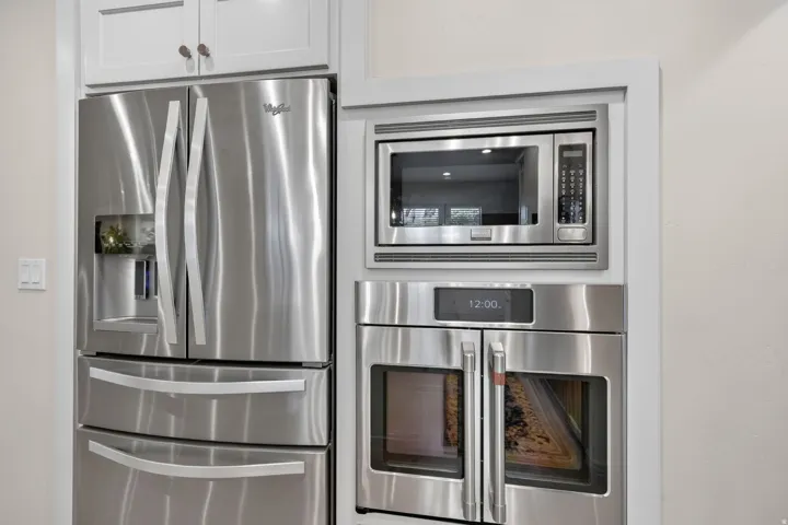 Built-in stainless steel double oven, microwave, and refrigerator