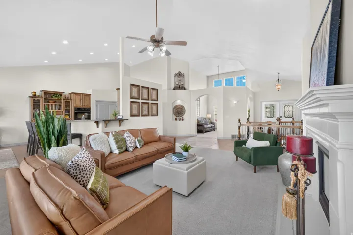 Vaulted ceilings, recessed lighting, and a built-in entertainment niche