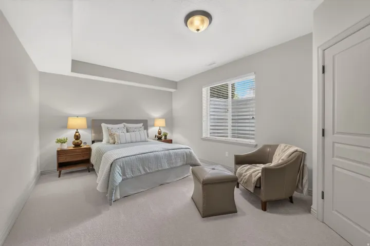 Recessed lighting, light gray carpet flooring, window with blinds, and paneled door