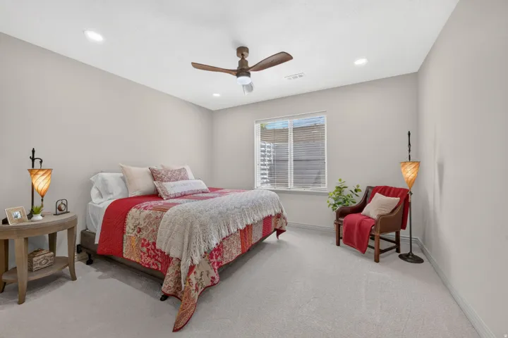Recessed lighting, ceiling fan, window with blinds, and light-toned carpeting
