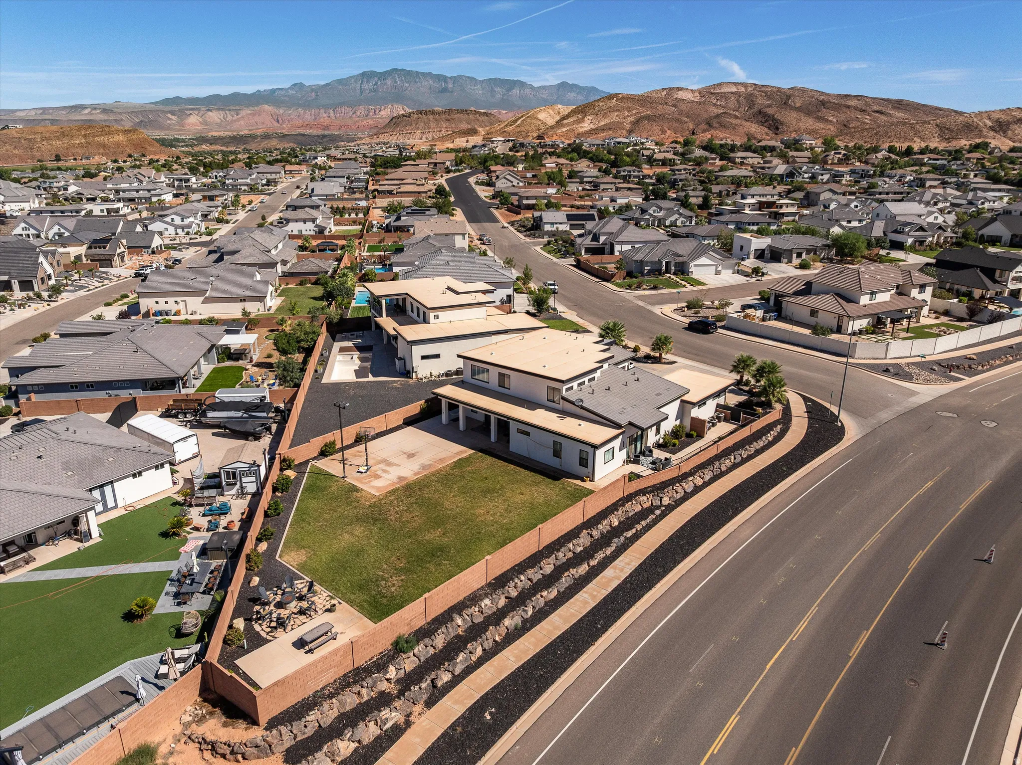 Expansive property with a large, flat yard area and block walls.