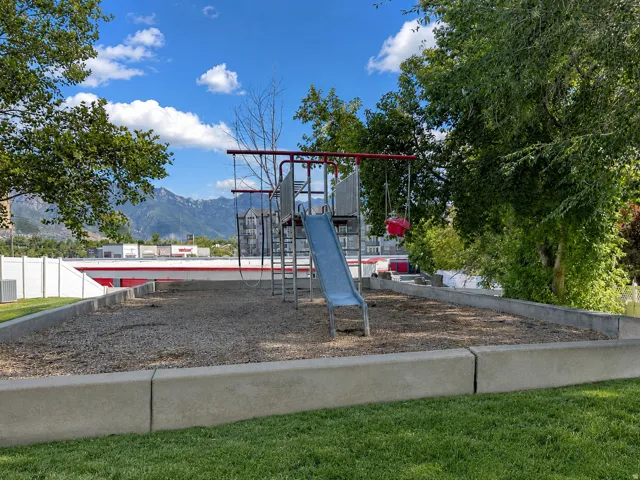 Recreational playground featuring a slide and swing set