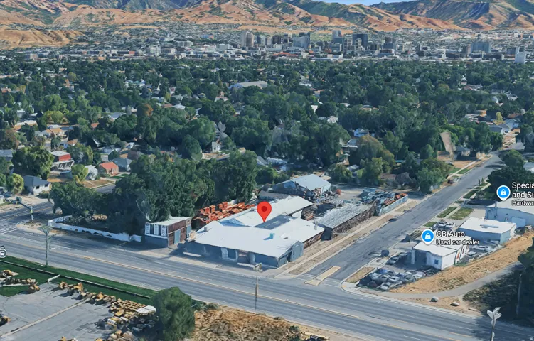 Commercial property with expansive lot, multiple buildings, and ample open-air storage capacity