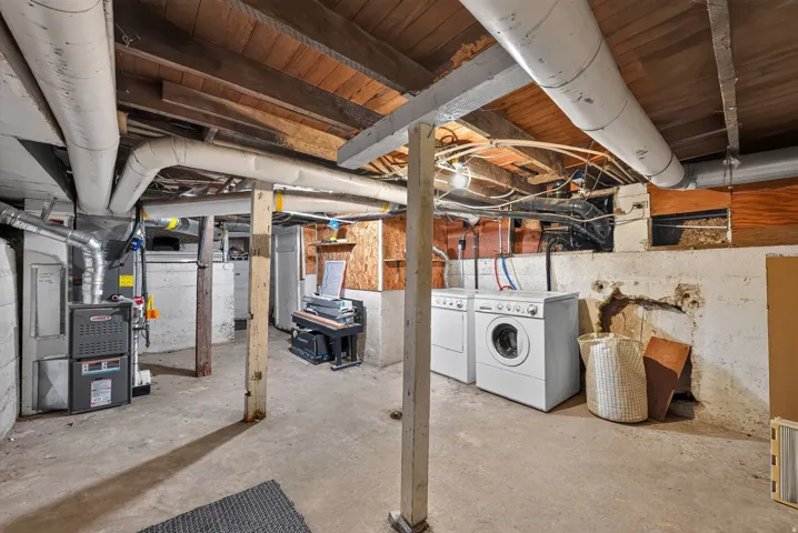 Concrete flooring with exposed ceiling joists and support beams