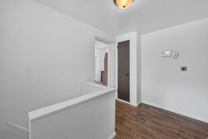 Wood-finish flooring with crisp white trim