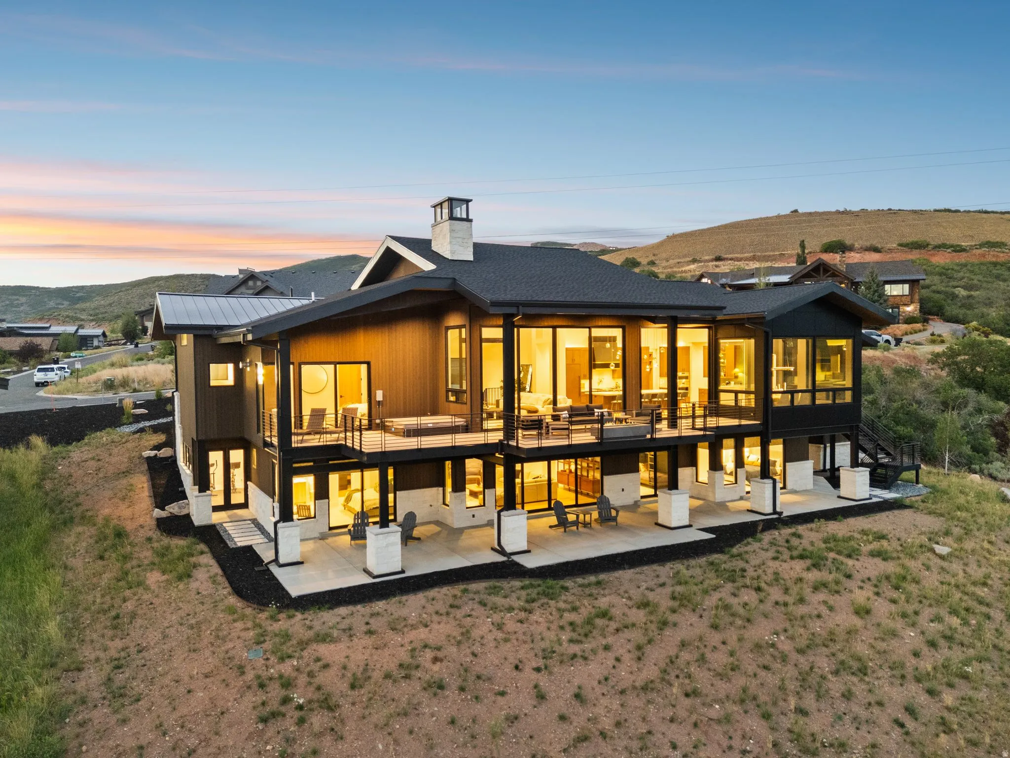 Modern architectural design with extensive glass paneling and a dark-toned exterior