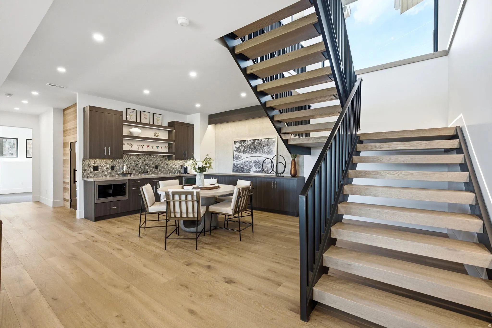 Contemporary wood-finish flooring with recessed lighting