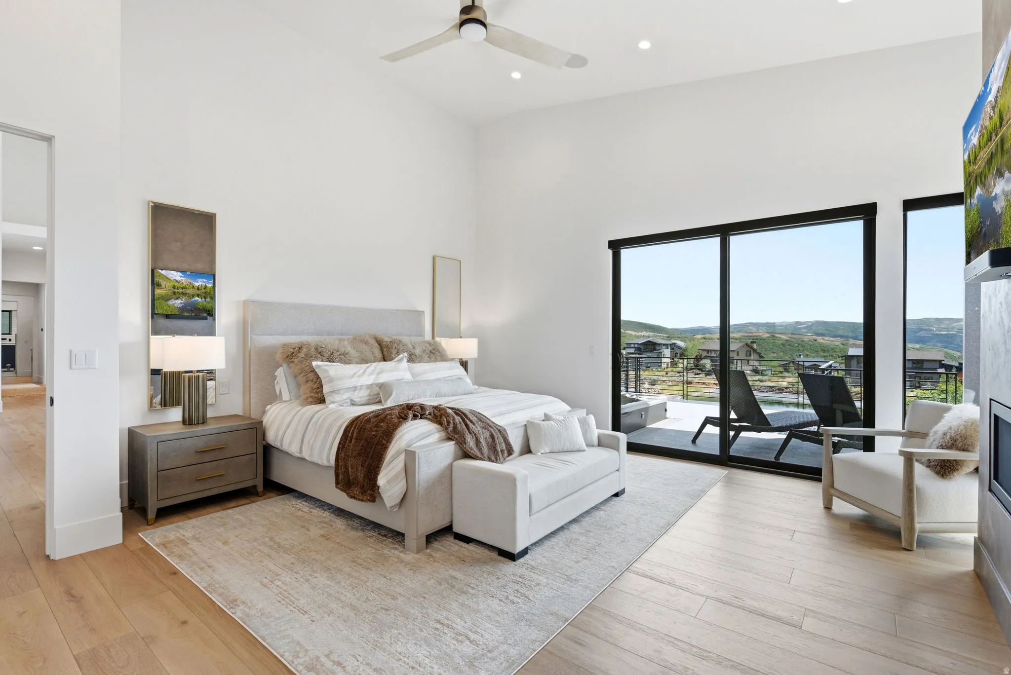 Vaulted ceilings, recessed lighting, and wood-finish flooring
