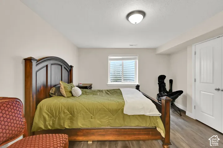 Recessed window with white blinds, neutral wall paint, white interior doors, andLVP flooring