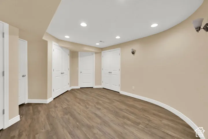 Recessed lighting illuminates the space, featuring new LVP flooring