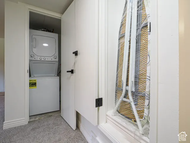 Built-in stacked washer and dryer within a dedicated closet