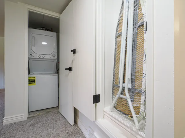Built-in stacked washer and dryer within a dedicated closet