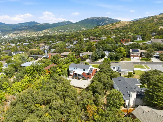Expansive mountain backdrop with a residential area