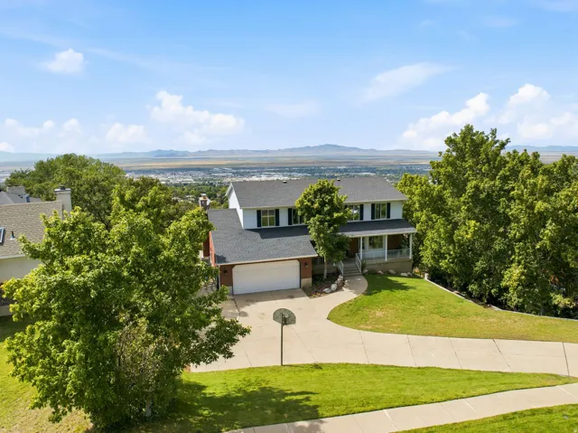 Two-story residence with a two-car garage and a paved driveway