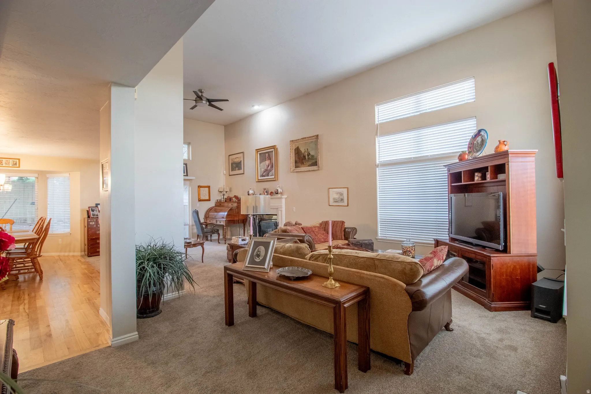 High ceilings, transom windows, ceiling fan, and recessed lighting
