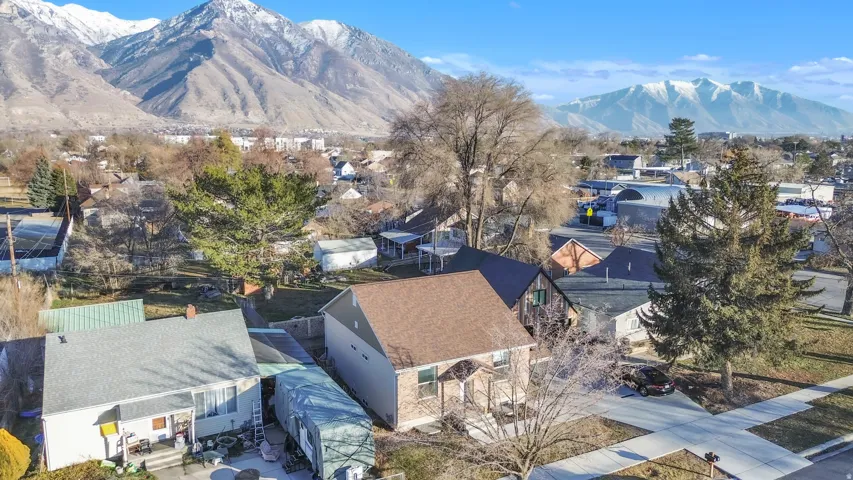 Neighborhood setting featuring established residences and mature trees