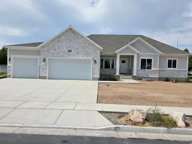 Stone veneer and siding exterior with a covered entry