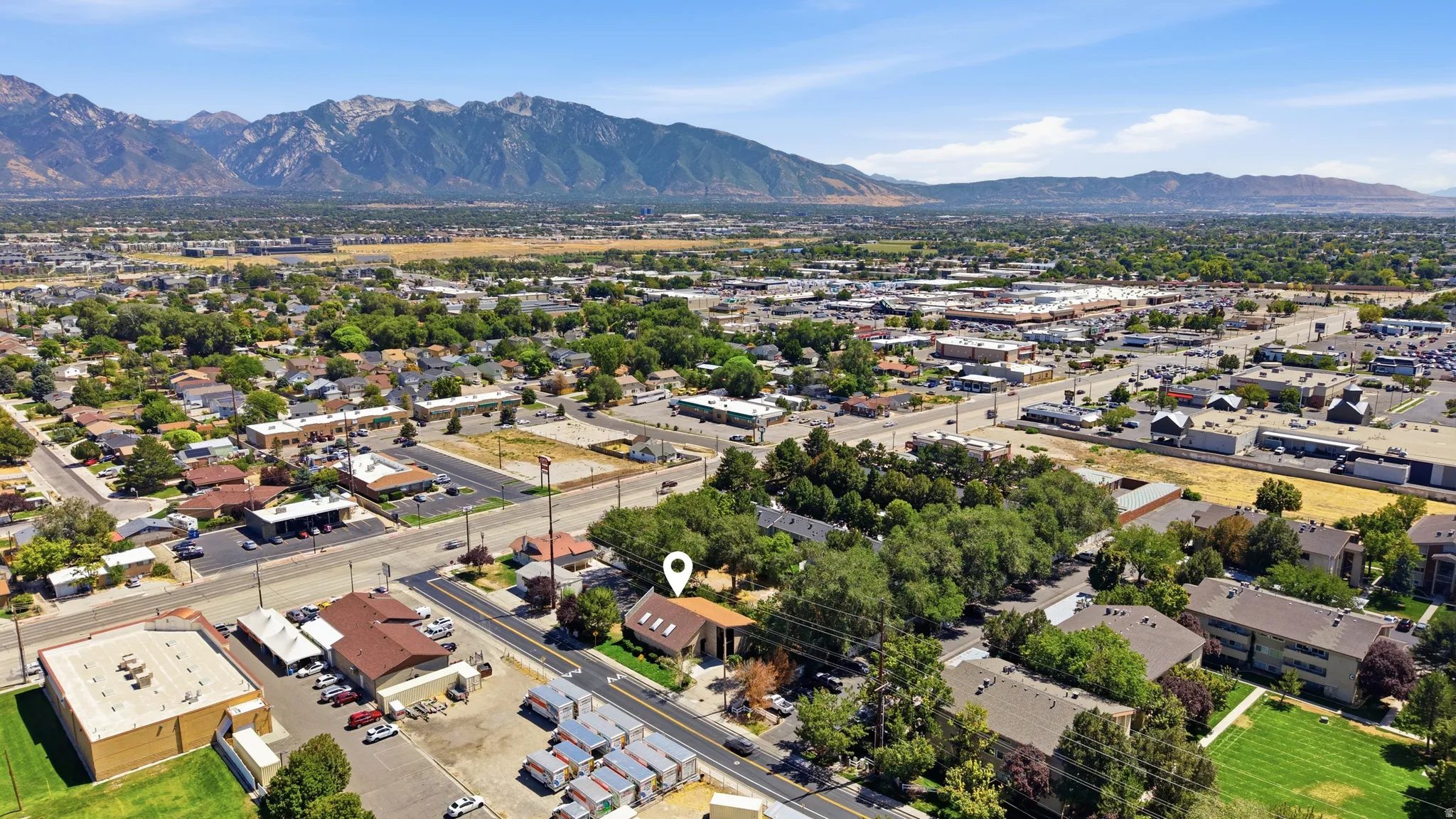 Mountainous terrain forms a prominent backdrop to the surrounding urban landscape
