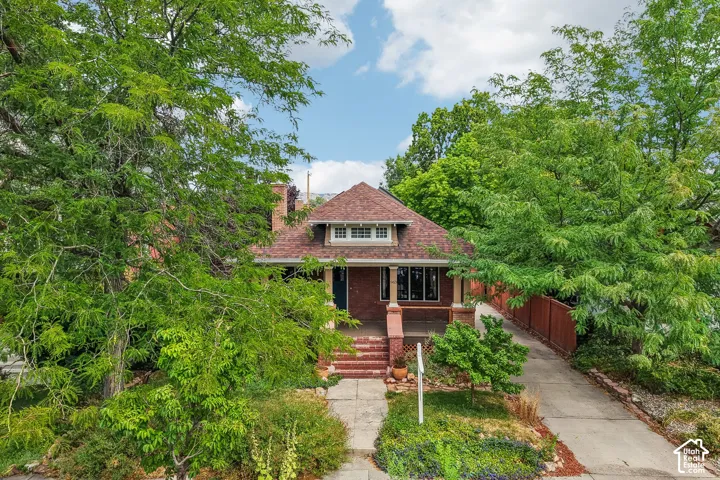 Brick exterior with a gabled roof and front porch