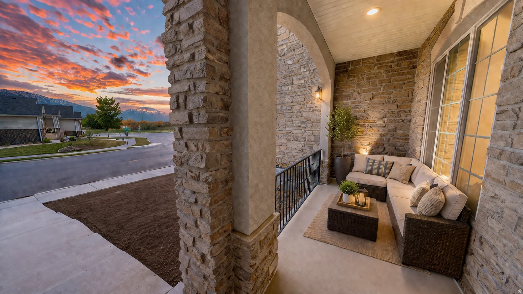 This is an Ai enhanced Photo. Covered front porch featuring stone facade, arched entry, metal railing, and recessed lighting