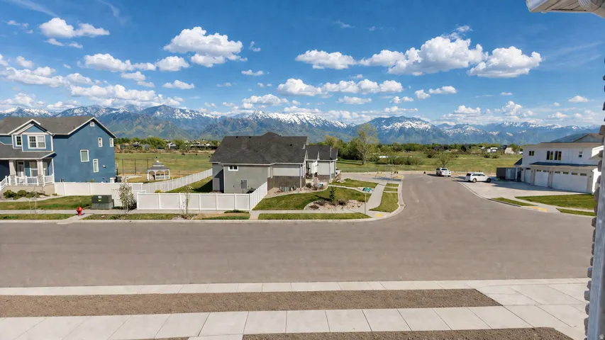 This is an Ai enhanced Photo. Residential area with paved streets and sidewalks