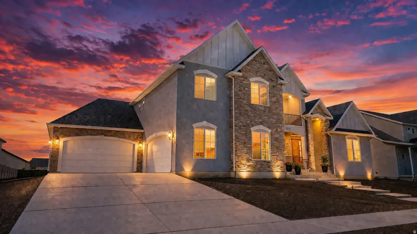 This is an Ai enhanced Photo. Multi-level stucco and stone exterior with architectural gables, a concrete driveway, and an attached two-car garage