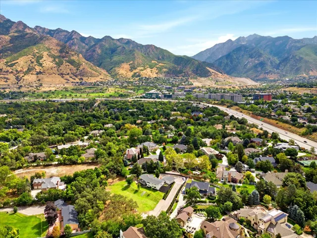 Sweeping aerial showcasing the property’s proximity to the Wasatch Mountains and convenient access to I-215.