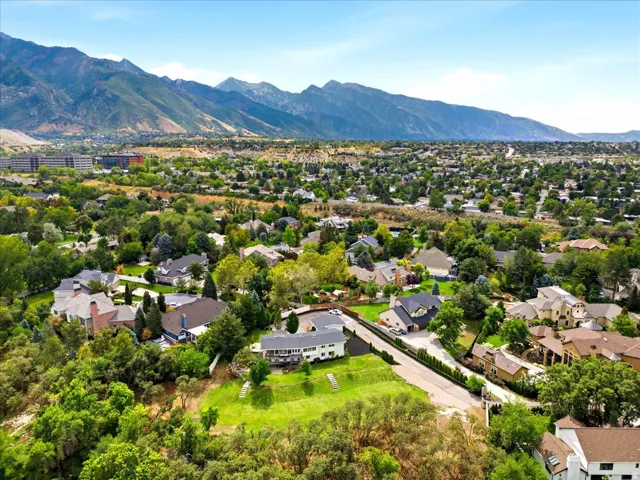 Panoramic aerial showcasing the Holladay setting with dramatic Wasatch Mountain views.