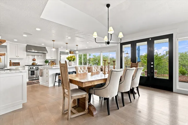 Open dining area connecting seamlessly to the updated kitchen and great room with abundant natural light.