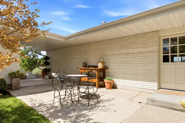 Additional patio beside the detached garage offering another inviting outdoor gathering space.