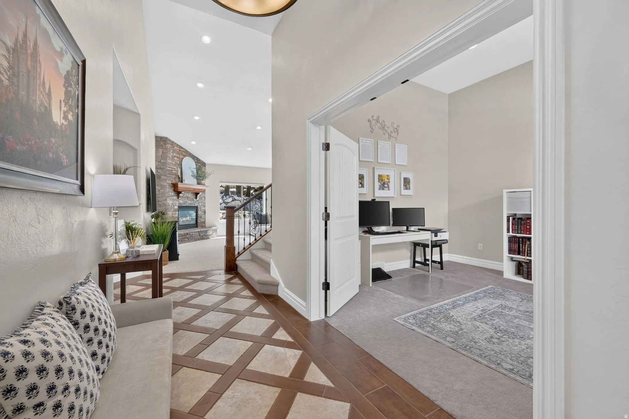 Grand entry featuring a patterned tile and wood-finish flooring